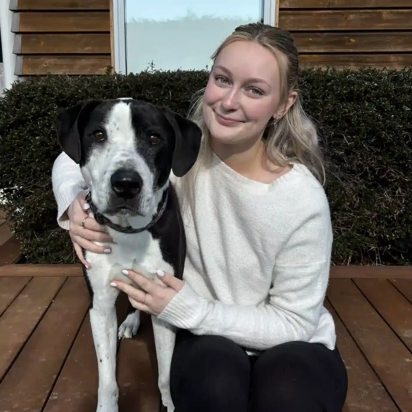 Tamzin and her dog. Tamzin is a doggy daycare specialist.